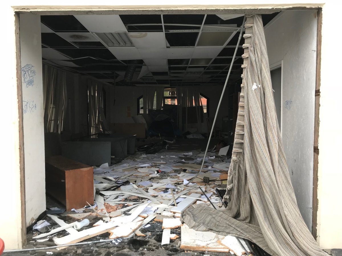 Commercial suite before cleaning: construction debris everywhere