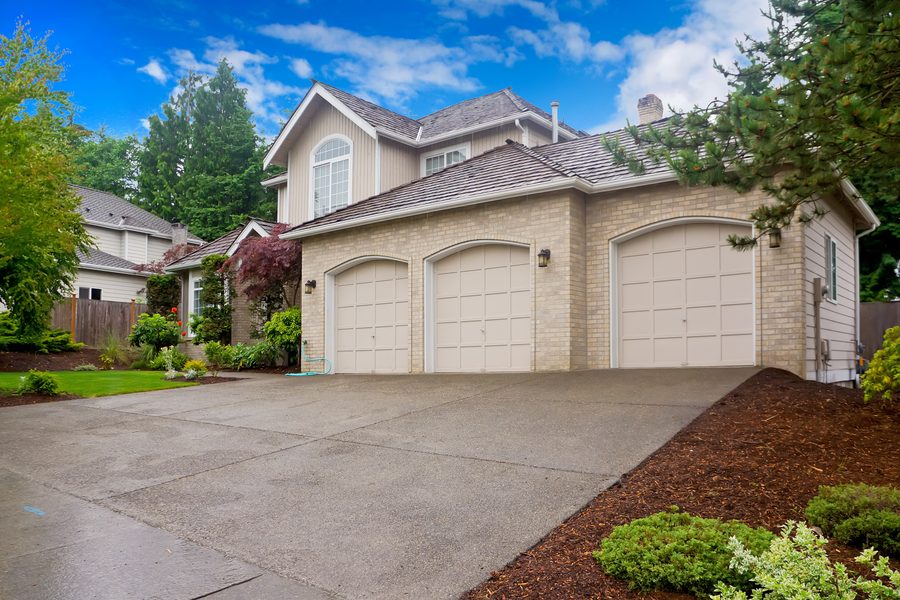 Home with a freshly power washed driveway